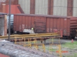 SLC 1083 Boxcar sits on a repair track